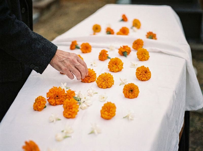 Marigolds and jasmine laid on a white cloth
